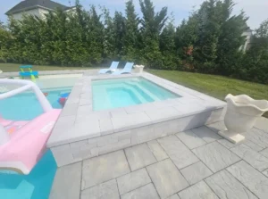 Finished fiberglass pool with patio by Atlantic Fiberglass Pools